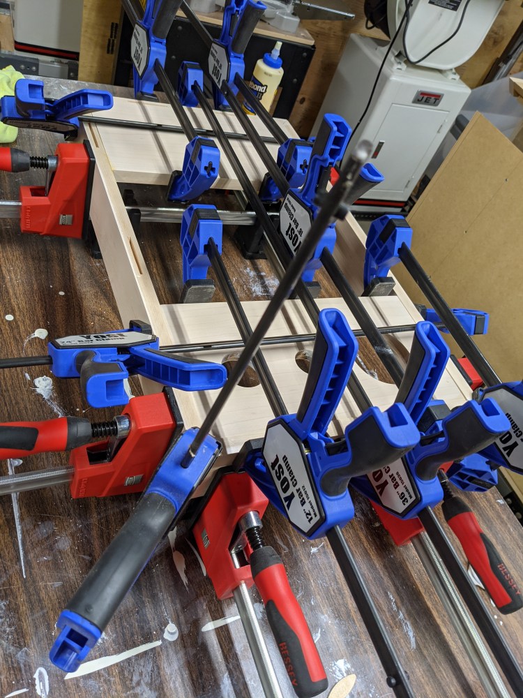 Parallel clamps first for alignment, then bar clamps to hold it down from every angle.