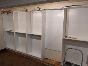 3) One more to go; you can see the plastic sheet behind the shelves in the gap